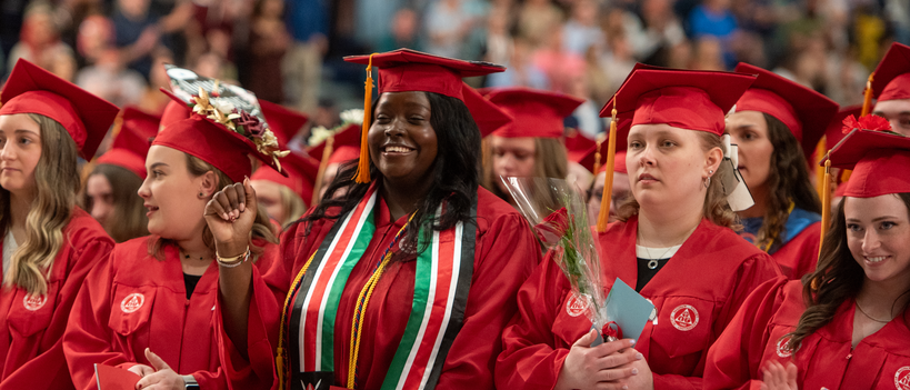 Students smiling at graduation